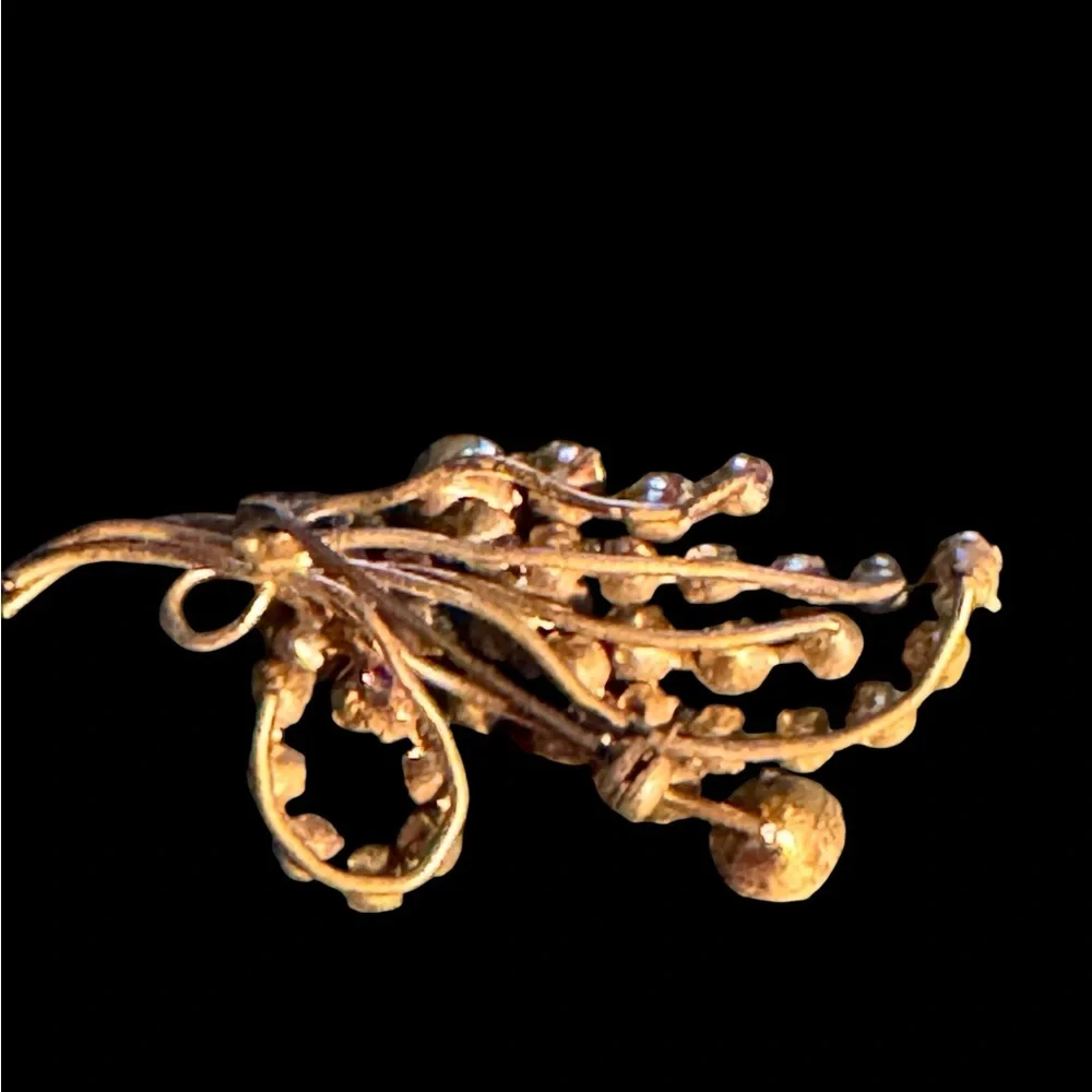 Two crystal brooches